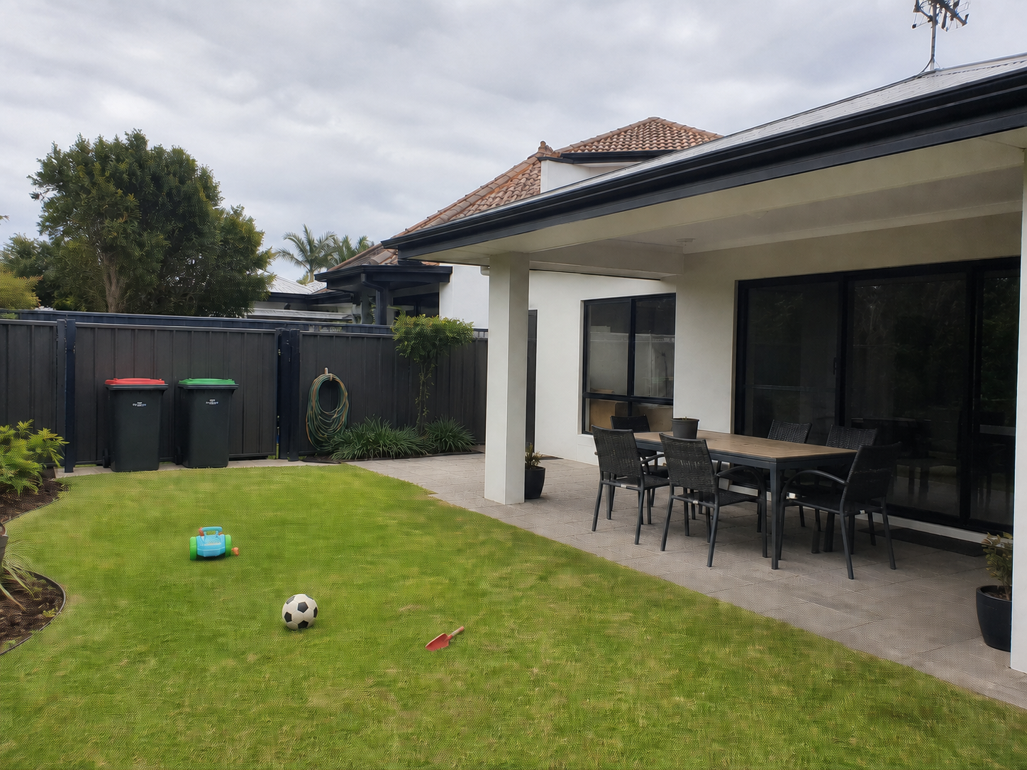 Patio bin, hose, toy and lawn-item removal, before